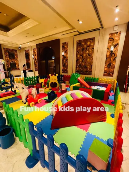 Another wide shot of the indoor rainbow play area, ready for a party.