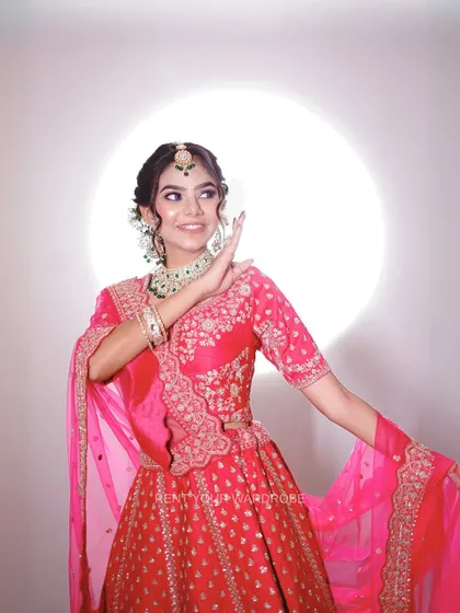 Another portrait in the pink lehenga, exuding grace and elegance.