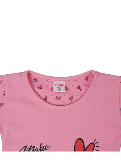 A close up shot of the neckline of a pink kids' t-shirt, showing the fabric detail and brand tag. Detail shots build customer confidence in your product's quality.