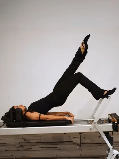 A beautiful shoulder bridge with leg extension. This move is a full-body wake-up call, strengthening the glutes, hamstrings, and core.