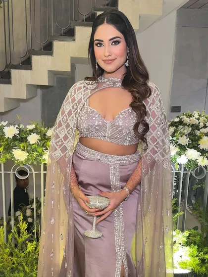 The perfect party look. The combination of the smokey eye, glowing skin, and stunning outfit is a guaranteed head-turner.