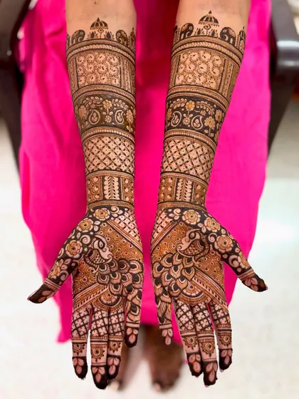 A straight-on shot, highlighting the symmetry and the detailed work on the palms.