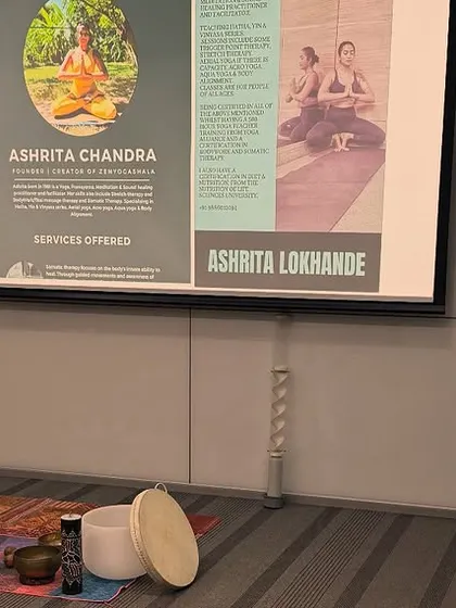 The setup before participants arrive for a corporate session at ABB. You can see my array of chakra colored singing bowls, a crystal bowl, and a frame drum, all ready to create a healing atmosphere.