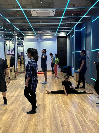 A shot from a dance class, showing students warming up and getting into the zone before we begin choreography.