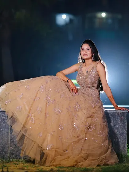 A seated portrait that shows off the volume and texture of her beautiful gown.