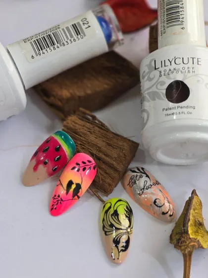 A showcase of summer-themed nail art, including a watermelon design and delicate floral silhouettes against a sunset ombre.