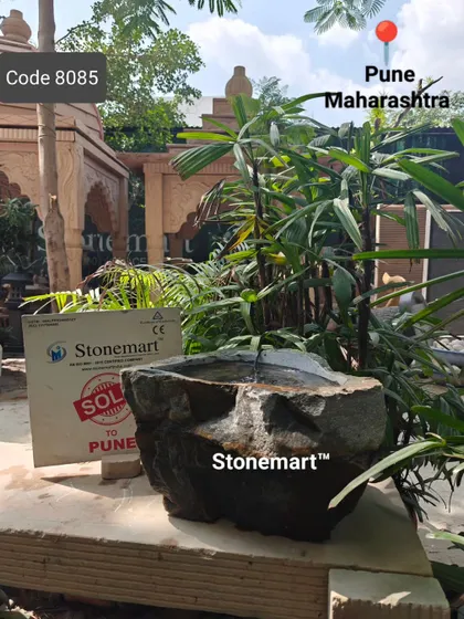 The rock bubbler fountain is a perfect, low-maintenance addition to a naturalistic garden design.