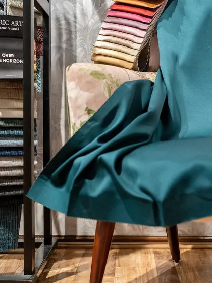 A beautifully upholstered chair showcasing the kind of custom work and fabric selection we love to do.