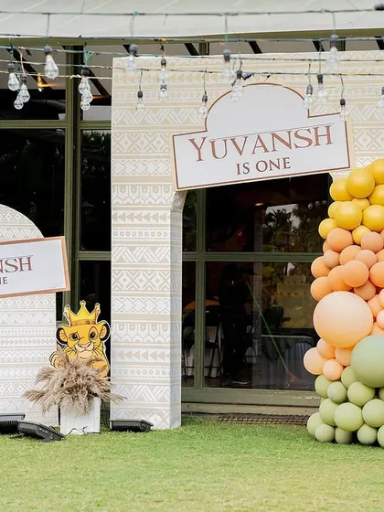 The entrance to a "Wild One" adventure. We used tribal patterns, earthy balloon colors, and Simba cutouts to set the tone for this Lion King inspired first birthday party.
