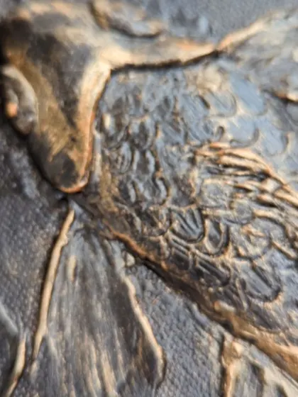An extreme close-up on the scales and fins of a koi fish. This macro shot highlights the detailed textural work that goes into each element, making the art compelling even from up close.