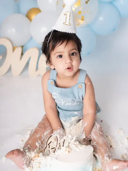 Success! This is the pure, unfiltered joy of a first birthday cake smash. I encourage the mess because it leads to the most genuine expressions and fun-filled photographs that you will treasure.