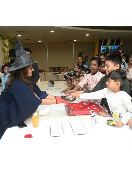A student gets to participate in a science demonstration, feeling the results of an experiment firsthand. These interactive moments are key to building confidence and curiosity.