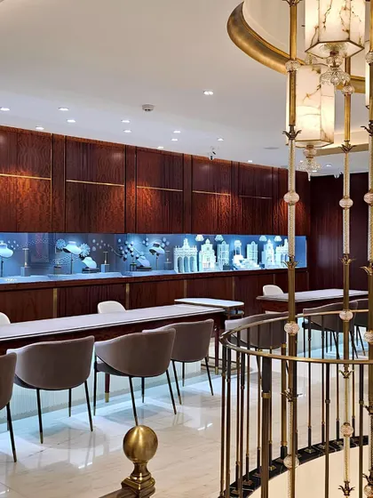 A cascading light installation crafted from alabaster and brass serves as the central anchor for the three-story Talwarsons flagship store in Chandigarh. This feature ties all levels together with a sense of quiet, vertical continuity.