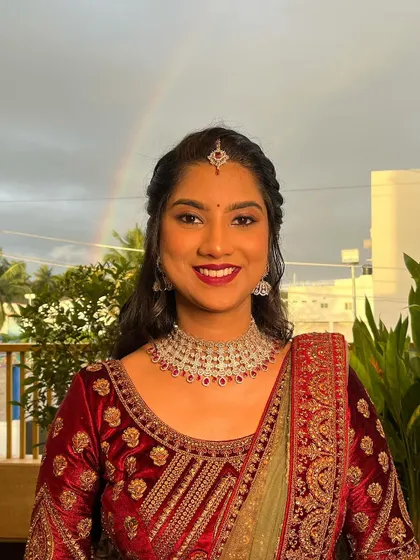 A subtle glam reception look, created exactly as the client requested. The beautiful rainbow in the background was a happy accident!