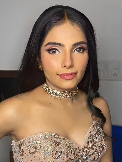 A breathtakingly beautiful portrait. The makeup is glamorous and modern, with a focus on sharp, defined eyes and a flawless, glowing complexion.