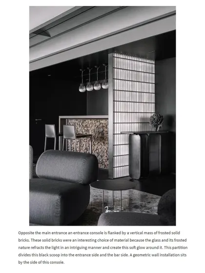 An ArchDaily feature highlighting our design philosophy for the Vaulted Haus entrance. The text explains how the frosted glass bricks and console create an interplay between the bar and the main entrance.