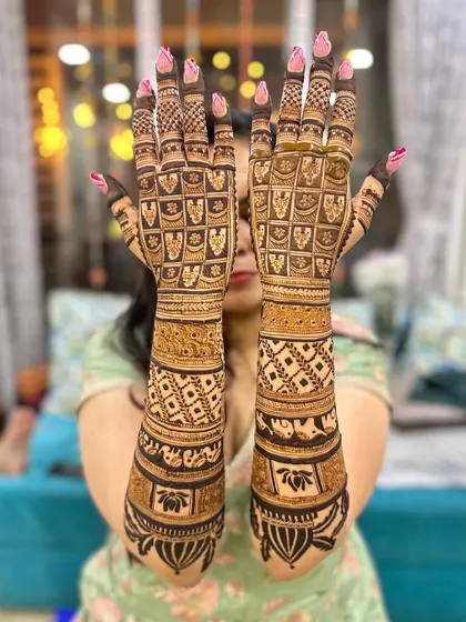 The back of the hands for a full bridal look. This design features a beautiful checkered pattern with lotus motifs, creating a stunning visual effect.
