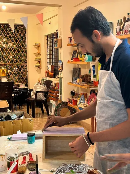 Applying a base coat of paint before starting the distressing process. This workshop is all about layering and revealing.