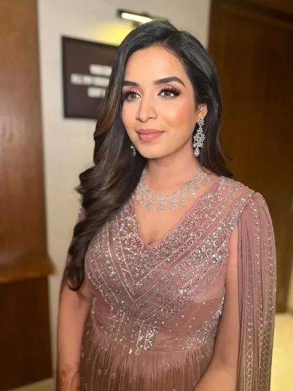 This angle shows how the makeup enhances her features, giving her a polished and elegant look for her celebration.