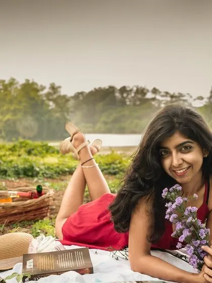 This personal branding portrait was shot outdoors to create a relaxed and natural vibe. It's perfect for an influencer or creative professional who wants to show their personality. The picnic setup and natural landscape add a layer of storytelling to the image.
