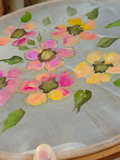 A work-in-progress shot of floral fabric painting. Our professional courses for boutique owners and designers cover techniques for creating hand-painted clothing collections.