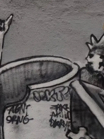 A detail from the mural showing a character throwing up the "rock on" horns. This is a nod to the heavy metal music that inspires much of my gothic and mechanical artwork.