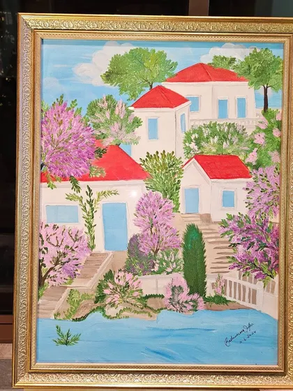 A charming painting of a waterside villa with blooming trees from the 'Art Soirée' collection by Badrunissa Irfan.