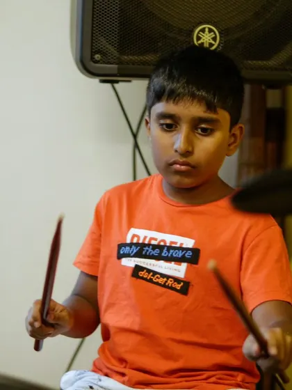 A young drummer at the summer camp recital. Our program is designed to be high-energy and super fun.