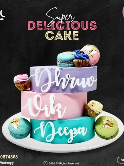 A vibrant and modern three-tier cake. Each tier has a different color and is personalized with a name, then decorated with colorful macarons and cupcakes for a fun, celebratory look.