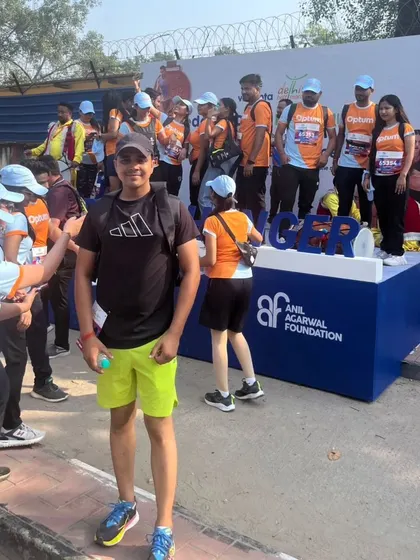 Posing at a sponsor's booth during the marathon event.
