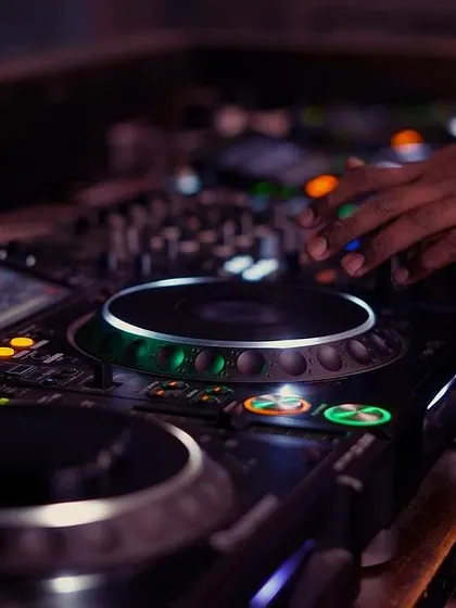Another close-up of the DJ console, showing the illuminated buttons and my hand ready to trigger the next beat.
