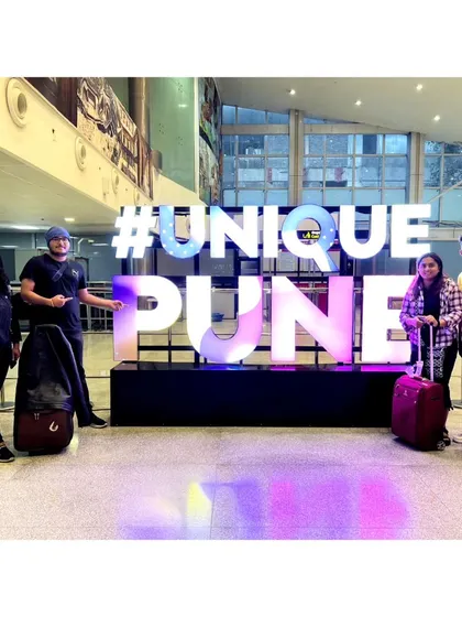 Posing with the #UniquePune sign at the airport. We were so excited to explore the city.