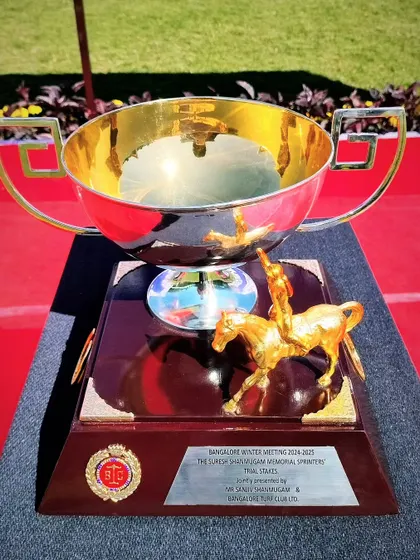 The Suresh Shanmugam Memorial Sprinter's Trial Stakes trophy, a grand silver bowl with a golden jockey figurine.