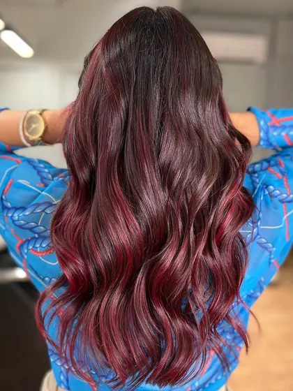 Save this as a reference for your next hair color. This red wine shade is deep, rich, and incredibly elegant.