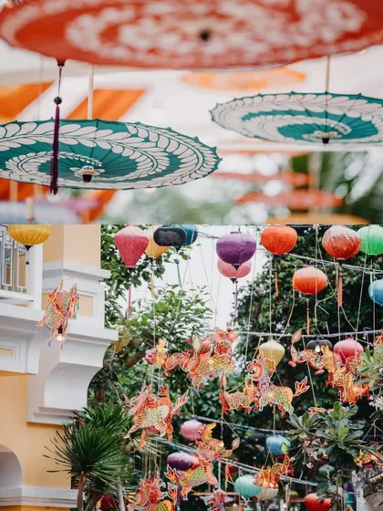 A collage of hanging decorations at a vibrant mehendi. The decor includes colorful lanterns, dragon-shaped hangings, and traditional painted umbrellas, creating a festive and eclectic look.