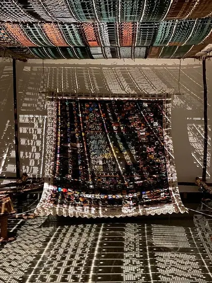 An immersive installation from Archana Hande's 'WEAVING LIGHT'. I believe in transforming spaces. Here, we used light and shadow projected through traditional jacquard loom punch cards to create a magical, shifting landscape that tells a story of craft and technology.