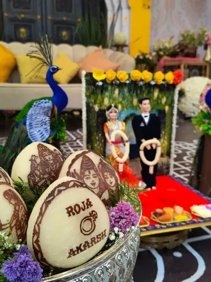 A close-up of our custom decorated coconuts for a wedding ceremony. We can add names, dates, and intricate traditional designs to make these ritual items truly personal and unique.