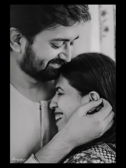 A sweet forehead kiss and a genuine laugh. Capturing real affection is my goal.