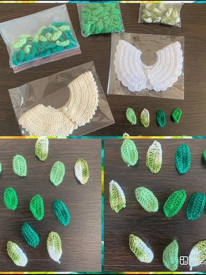 A behind-the-scenes look at an order for a boutique, featuring my crochet collars and handmade leaf appliques in various shades of green.