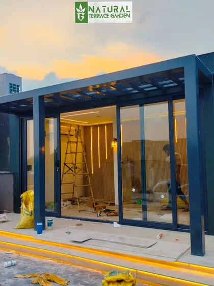 The porta-cabin during the final stages of construction, with the interior lighting and framework visible.