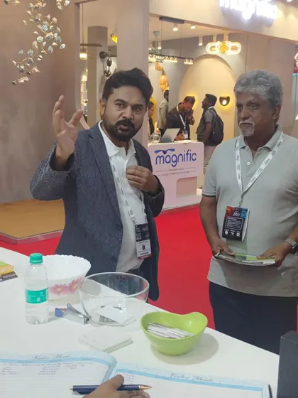 Explaining the technical aspects of my automation systems to an engaged visitor. My goal is to make complex technology easy to understand and use.