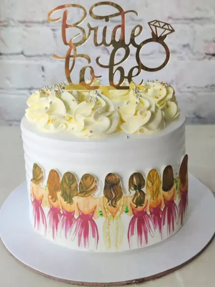 For the bride and her squad! This cake features a lovely illustration of the bridesmaids and a "Bride to be" topper, celebrating the whole team.