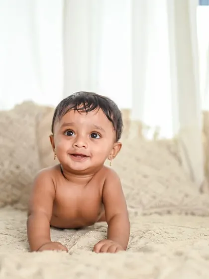 A simple and natural shot of a baby crawling. Milestone sessions are perfect for capturing these big achievements.