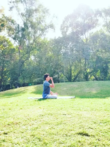 In the tranquility of nature, I practice Nadi Shuddhi Pranayama, or alternate nostril breathing. The breath, or *prana*, is our vital life force. My sessions focus on teaching correct breathing techniques to calm the nervous system, reduce stress, and purify the energy channels of the body, which is fundamental for overall health.