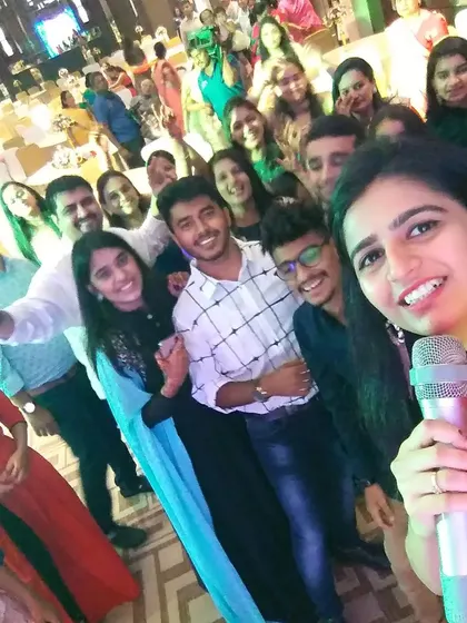 The audience members are my real cheerleaders. This selfie captures the incredible energy and love I get back from the crowd. Connecting with people and seeing their happy faces is the most rewarding part of being an event host.