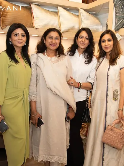 Nothing is better than celebrating with the people you love and care about. This photo captures a warm moment with friends and family at the launch of my new soft furnishings collection.