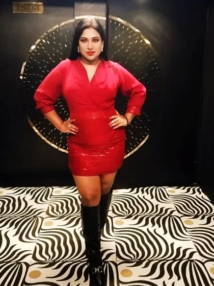 Another pose from the Zozo Christmas bash. This look combines festive red with a powerful stance, ready for a great night.