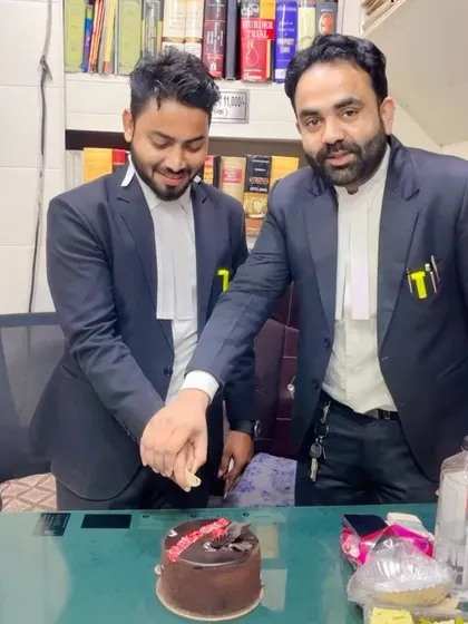 Cutting the cake to celebrate my official entry into the profession.