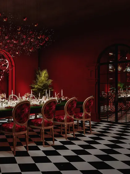 A view of the dining area looking towards the bar, showing the cohesive yet distinct zones within the space.