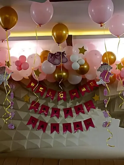 A close-up of the "Welcome" and name banners.